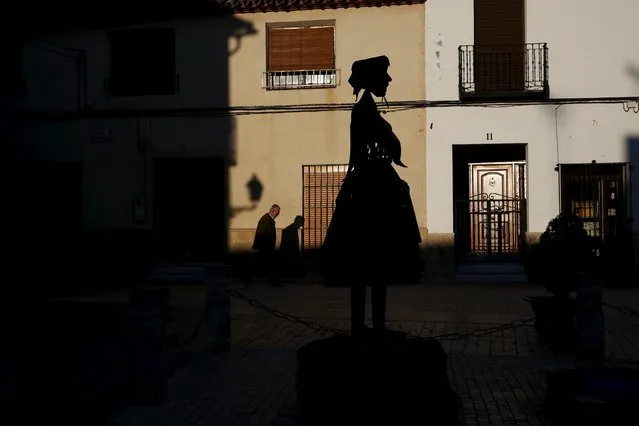 A man walks past a statue of Don Quixote's ladyship Dulcinea in her hometown of El Toboso, Spain, April 7, 2016. (Photo by Susana Vera/Reuters)