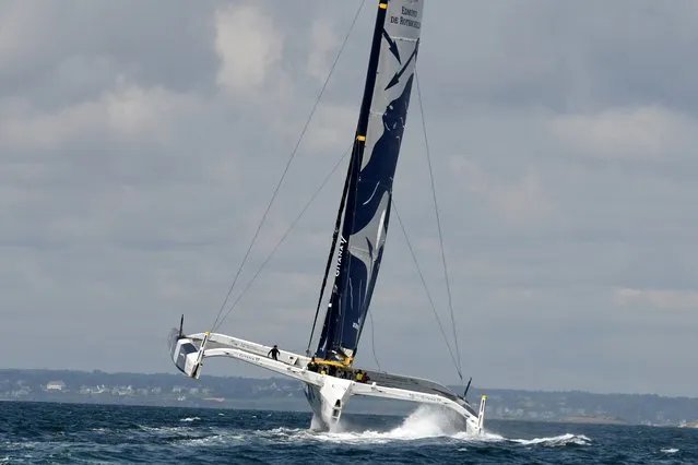 French skippers Charles Caudrelier and Franck Cammas sail on their multihull “Maxi Edmond de Rothschild” on July 18, 2019, off the coast of Lorient, western France, during a training session ahead of the Rolex Fastnet yacht race. (Photo by Jean-Francois Monier/AFP Photo)