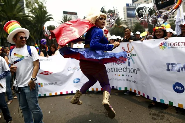 A participant jumps during a Gay Pride Parade in Mexico City, June 27, 2015. (Photo by Edgard Garrido/Reuters)