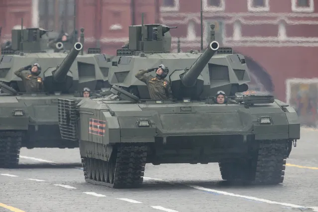 Russian soldiers drive military vehicles along Red Square during the Victory Day military parade to celebrate 72 years since the end of WWII and the defeat of Nazi Germany, in Moscow, Russia, on Tuesday, May 9, 2017. (Photo by Ivan Sekretarev/AP Photo)