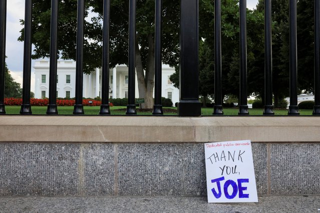 A placard is pictured as people gather outside the White House after U.S. President Joe Biden announced he is stopping his bid for reelection, in Washington, D.C., U.S., July 21, 2024. (Photo by Kevin Mohatt/Reuters)