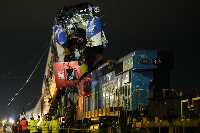 Police inspect the crash site where a freight train collided head-on with another train on a test run, in San Bernardo, on the outskirts of Santiago, Chile, June 20, 2024. (Photo by Esteban Felix/AP Photo)