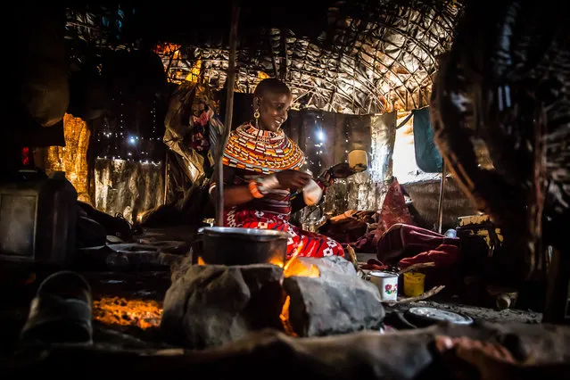 “A Beaded Woman”. A young Samburu woman prepares tea for visitors. Photo location: Isiolo, Kenya. (Photo and caption by Ralph Pace/National Geographic Photo Contest)