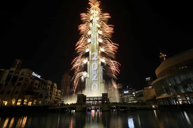 Fireworks explode around the Burj Khalifa, the tallest building in the world, during New Year's celebrations in Dubai, United Arab Emirates on January 1, 2020. (Photo by Christopher Pike/Reuters)