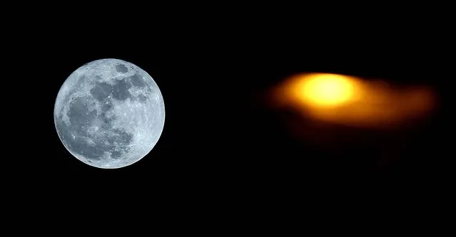 The full perigee moon rises over Namur, Belgium