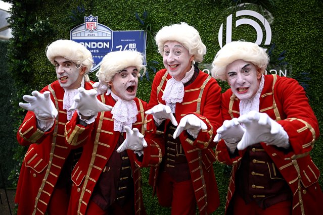 Fans pose for a photo, outside the stadium, while wearing fancy dress prior to the NFL match between Jacksonville Jaguars and Chicago Bears at Tottenham Hotspur Stadium on October 13, 2024 in London, England. (Photo by Harry Murphy/Getty Images)