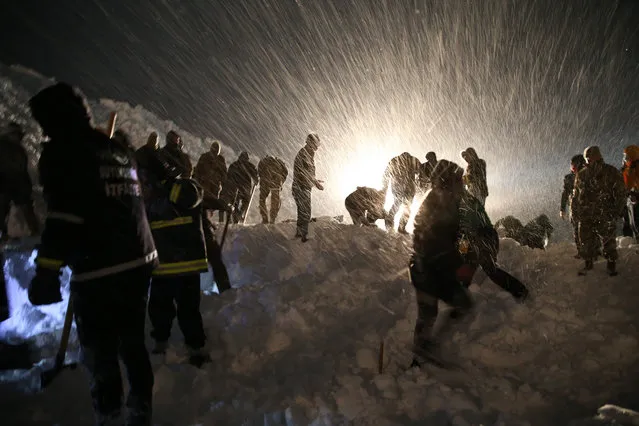 Search and rescue works are conducted at site to find a construction equipment and a van, which have been buried under avalanche with passengers, at Van-Bahcesaray highway in Van, Turkey on February 4, 2020. (Photo by Ozkan Bilgin/Anadolu Agency via Getty Images)