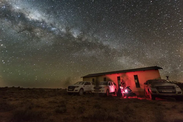 Scientists position their telescope beside a small church in the Karoo desert in South Africa on the morning of June 3, 2017. They were one of at least 54 observing teams with dozens of telescopes dispatched across two continents, positioned to catch a rare, two-second glimpse of a small, distant Kuiper Belt object passing in front of a star. Teams were hoping to capture the fleeting starlit shadow of 2014 MU69, which the New Horizons spacecraft will explore in a flyby on New Year’s Day 2019. (Photo by Henry Throop/NASA/JHUAPL/SwRI)