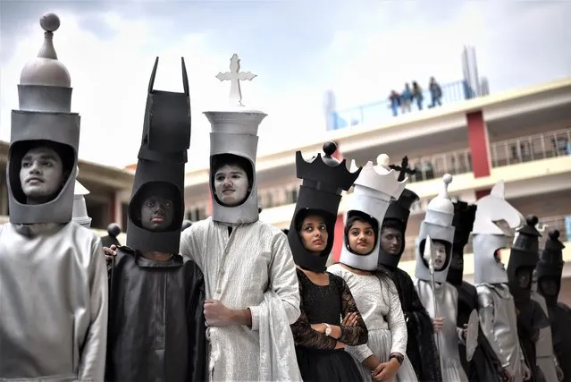 Students dressed up as black and white chess pieces take part in the celebrations ahead of the 44th Federation Internationale des Echecs (FIDE) Chess Olympiad 2022, at a school, in Chennai, India, 26 July 2022. Several school students dressed up as chess pieces move across a life-sized chess board to simulate a live game as they take part in the celebrations to welcome the 44th Federation Internationale des Echecs (FIDE) Chess Olympiad  2022. The Chess Olympiad will be held from 28 July to 10 August in the coastal town of Mahabalipuram near Chennai. More than 2000 players are expected to participate. (Photo by Idrees Mohammed/EPA/EFE)