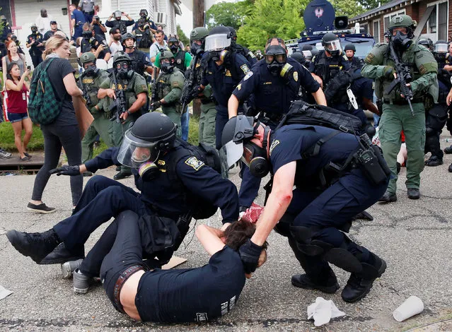 A demonstrator is detained by police during protests in Baton Rouge, Louisiana, U.S., July 10, 2016. (Photo by Shannon Stapleton/Reuters)