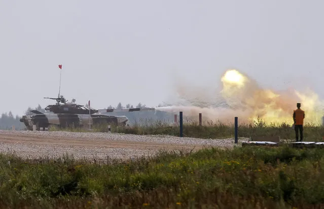 A tank fires at a target on the course of the Tank Biathlon competition during the International Army Games 2016 in Alabino, outside Moscow, Russia, July 30, 2016. (Photo by Maxim Zmeyev/Reuters)