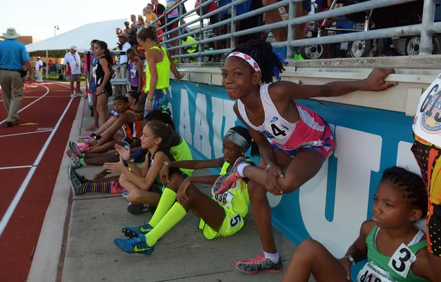 Juennes Track Club athlete Rainn Rudolph (4) stretches before her heat of the Girls 3000 Meter Run at the 2016 AAU Junior Olympic Games at Turner Stadium in Humble, Texas, on Monday, August 1, 2016. The biggest surprise Monday for Sheppard, competing at the Junior Olympics in Houston and far from the New York City homeless shelter she shares with her two sisters and mother, wasn't the gold medal she won in the 3,000 meters. It was the arrival of her mother. (Photo by Jerry Baker/Houston Chronicle via AP Photo)