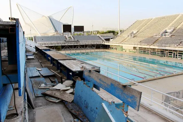 Seats for reporters at the main swimming pool for the 2004 Summer Olympic Games in Athens remain desolate, August 20, 2014. (Photo by Kyodo News/Newscom)