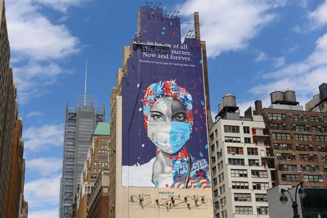 A mural dedicated to nurses is painted on the side of a building on 34th Street and Eighth Avenue in Midtown Manhattan, New York on May 4, 2020. (Photo by Erik Pendzich/Rex Features/Shutterstock)