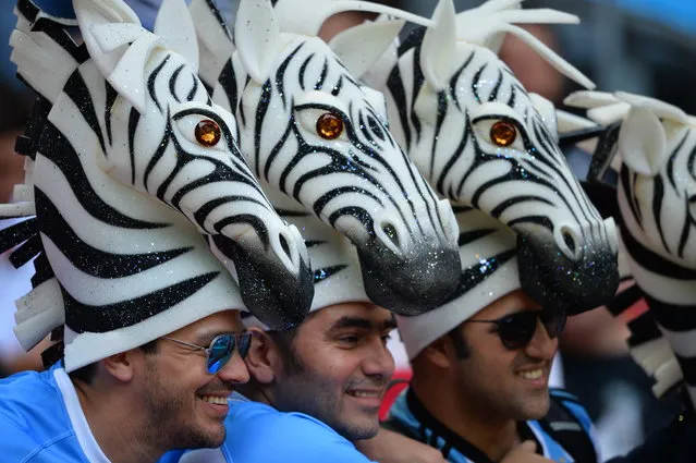 Argentina supporters pose with zebra-shaped hats before  a Pool C match of the 2015 Rugby World Cup between New Zealand and Argentina at Wembley stadium, north London on September 20, 2015. (Photo by Glyn Kirk/AFP Photo)