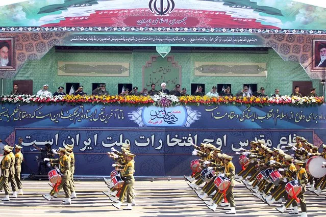 Members of the Iranian Army march past President Hassan Rouhani (C top) and military commanders during a parade marking the anniversary of the Iran-Iraq war (1980-88), in Tehran September 22, 2015. (Photo by Raheb Homavandi/Reuters/TIMA)