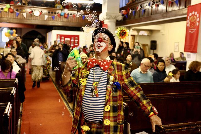 Mattie the clown blows bubbles as clowns and entertainers attend the annual service of remembrance in honour of British clown Joseph Grimaldi who died in 1837, at All Saints Church in Haggerston, London, Britain, on February 4, 2024. (Photo by Kevin Coombs/Reuters)