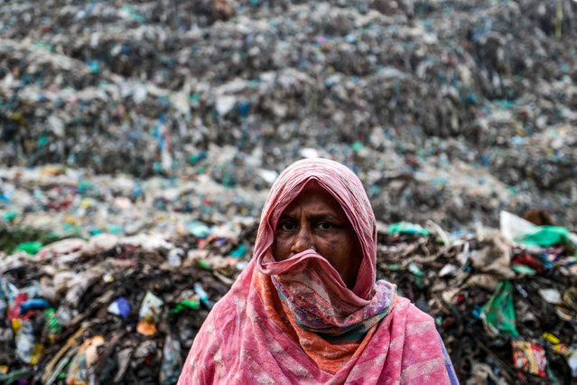 A person who lives next to the landfill poses for a picture at a landfill that is a huge emitter of Methane, a strong greenhouse gas on January 21, 2025 in Barisal, Bangladesh. The uncontrolled methane emissions released from landfills in Bangladesh are seen as one of the main contributors to the ongoing heatwave and rising temperatures across the country. The waste emanating from these sites, which pose a serious health threat, spreads to nearby neighborhoods and farms, while the lack of sufficient waste recycling facilities results in harmful substances leaching into the soil. (Photo by Niamul Rifat/Anadolu via Getty Images)
