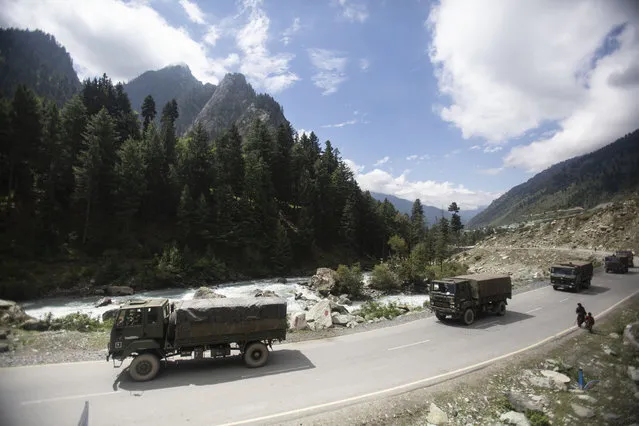 An Indian army convoy moves on the Srinagar- Ladakh highway at Gagangeer, northeast of Srinagar, Indian-controlled Kashmir, Tuesday, September 1, 2020. India said Monday its soldiers thwarted “provocative” movements by China’s military near a disputed border in the Ladakh region months into the rival nations’ deadliest standoff in decades. China's military said it was taking “necessary actions in response”, without giving details. (Photo by Mukhtar Khan/AP Photo)