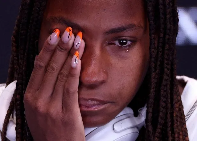 This handout picture taken on January 22, 2023 and released by Tennis Australia on January 23, 2023, shows Coco Gauff of the US getting emotional during a press conference after her defeat against Latvia's Jelena Ostapenko in the women's singles match on day seven of the Australian Open tennis tournament in Melbourne. (Photo by Loren Elliott/Reuters)