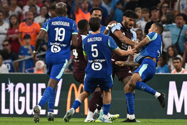 Aston Villa's English defender #05 Tyrone Mings scuffles with (R) Marseille's English forward #10 Mason Greenwood during the friendly football match between Olympique de Marseille (OM) and Aston Villa at the Velodrome stadium in Marseille, southern France on August 9, 2025. (Photo by Miguel Medina/AFP Photo)