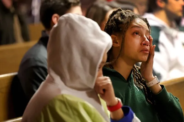 Students and others from the community attend a prayer service at Eastminster Presbyterian Church for those killed and injured at Michigan State University on February 14, 2023 in East Lansing, Michigan. A gunman opened fire at two locations on campus last night, killing three students and injuring several others before taking his own life. (Photo by Scott Olson/Getty Images via AFP Photo)