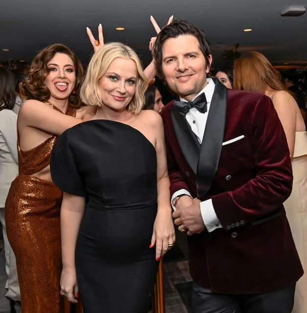 American comedian Aubrey Plaza photobombs her “Parks & Recreation” costars American actors Amy Poehler and Adam Scott at the 2023 SAG Awards on Sunday, Feb. 26, 2023, at the Fairmont Century Plaza in Los Angeles. (Photo by Earl Gibson/Shutterstock for SAG Awards)