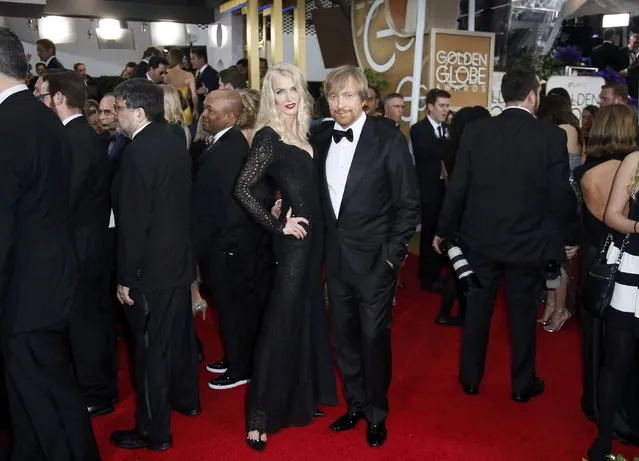 Director Morten Tyldum and a guest arrive at the 72nd Golden Globe Awards in Beverly Hills, California January 11, 2015. (Photo by Danny Moloshok/Reuters)