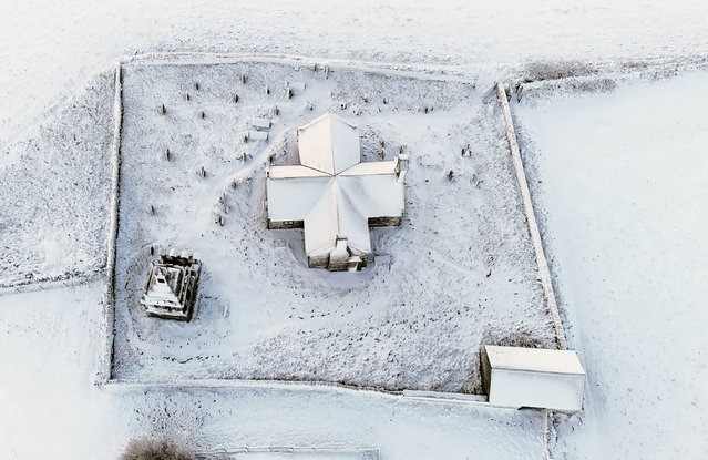 Overnight snow covers St Andrew's Church on Kiln Pit Hill in Northumberland, England, Wednesday,  November 19, 2025. (Photo by Owen Humphreys/PA via AP Photo)