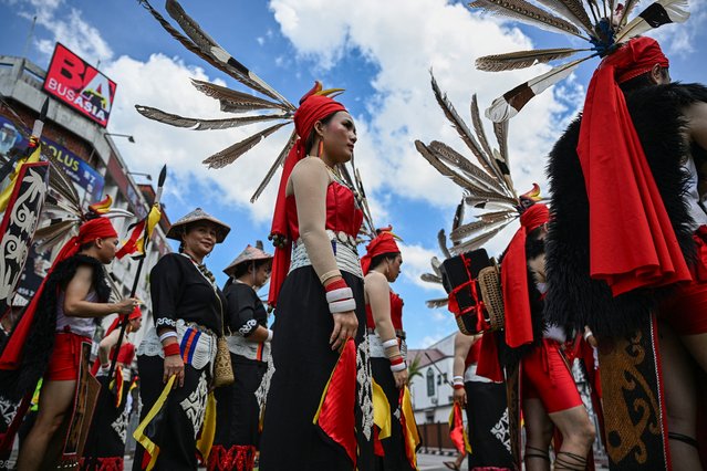 Indigenous Iban groups gather before the Gawai Dayak Culture Parade in Kuching, capital of the Malaysian state of Sarawak on the island of Borneo, on June 21, 2025. (Photo by Mohd Rasfan/AFP Photo)