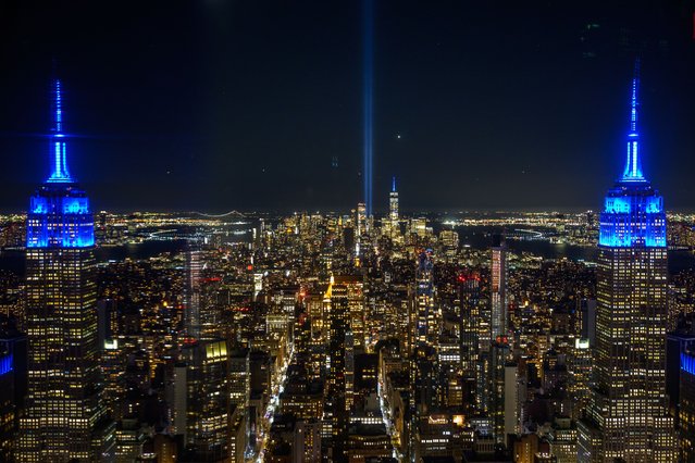 The annual Tribute In Lights display is framed by The Empire State Building reflected off a mirror at Summit One Vanderbilt on the 23rd anniversary of the 9/11 terror attacks on September 11, 2024 in New York City. The nation is marking the twenty-third anniversary of the attacks on September 11, 2001, that killed 2,977 people at the World Trade Center site, the Pentagon, and those aboard Flight 93 in Shanksville, PA. (Photo by Alexi Rosenfeld/Getty Images)
