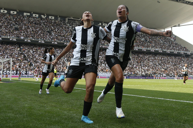 Corinthians forward Jaqueline Ribeiro (L) celebrates with teammate midfielder Victoria Albuquerque after scoring a goal during the women's Brazilian Championship 2024 final match between Corinthians and Sao Paulo at the Neo Quimica Arena in Sao Paulo, Brazil, on September 22, 2024. (Photo by Miguel Schincariol/AFP Photo)