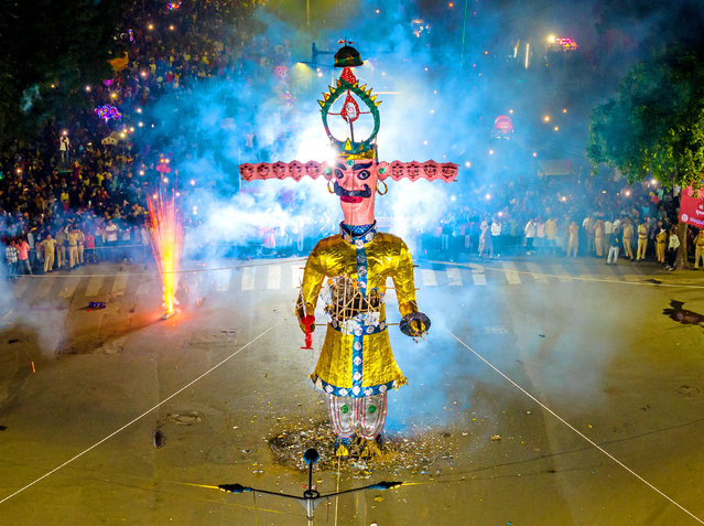 An effigy of Ravana, the ten-headed king of the demons, is set on fire during Dussehra celebrations in Ahmedabad, India on October 12, 2024. The burning is symbolic of the victory of good over evil. (Photo by Saurabh Sirohiya/Solent News)