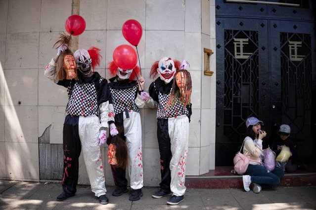Participants dressed as zombie clowns take part in the Zombie Walk, in Santiago, Chile, on October 20, 2024. (Photo by Pablo Sanhueza/Reuters)