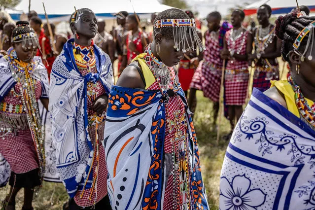 A group of Maasai women march while dancing traditional songs during a Maasai cultural festival in Sekenani, on June 10, 2023. The Maasai people are a Nilotic ethnic group inhabiting Kenya and northern Tanzania. The Maasai cultural festival is a popular gathering and celebration of the Maasai cultural heritage and aims to showcase the community's traditional activities and fashion. (Photo by Luis Tato/AFP Photo)