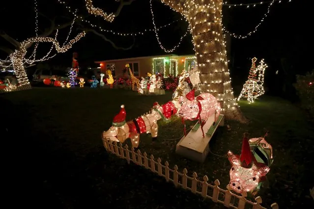 Holiday lights are seen on a home in the Sleepy Hollow neighborhood of Torrance, California, United States, December 15, 2015. (Photo by Lucy Nicholson/Reuters)