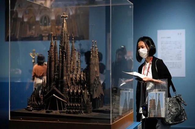 A visitor looks at a Sagrada Família model displayed during the press preview of the “Gaudi and the Sagrada Família” exhibition at the National Museum of Modern Art, in Tokyo, Japan, 12 June 2023. The exhibition, which focuses on the Sagrada Família presenting more than 100 drawings, models, photographs and materials, will be opened to the public from 13 June until 10 September 2023. (Photo by Franck Robichon/EPA/EFE)