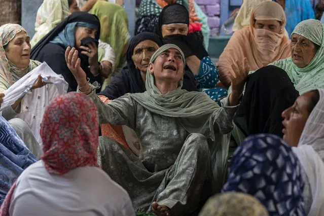 Unidentified relatives of Waseem Sarvar Bhat, an Indian army solider who was killed in a gunfight with suspected rebels, grieve at his residence in Bandipora, north of Srinagar, Indian controlled Kashmir, Saturday, August 5, 2023. Three Indian soldiers were killed in a gunbattle with rebels fighting against New Delhi’s rule in Kashmir, officials said Saturday, as authorities stepped up security on the fourth anniversary since India revoked the disputed region’s special status. (Photo by Dar Yasin/AP Photo)