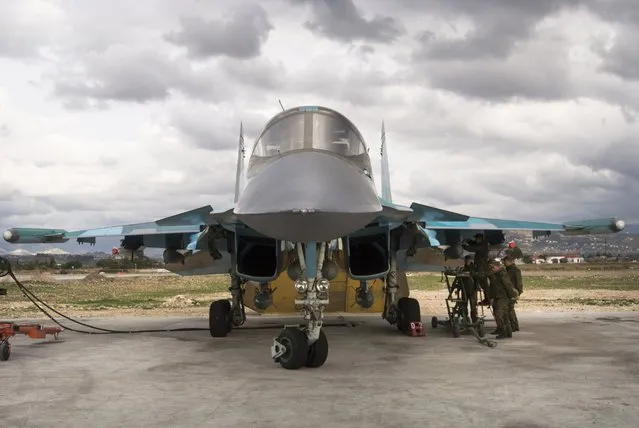 Russian air force crew prepare a bomber for a combat mission at Hemeimeem air base in Syria on Wednesday January 20, 2016. (Photo by Vladimir Isachenkov/AP Photo)