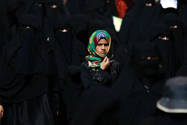 A Yemeni girl looks on during a protest by women in front of United Nations (UN) office in the Yemeni capital Sanaa on January 21, 2016, against the ongoing military operations and air strikes carried out by the Saudi-led coalition in their country. (Photo by Mohammed Huwais/AFP Photo)
