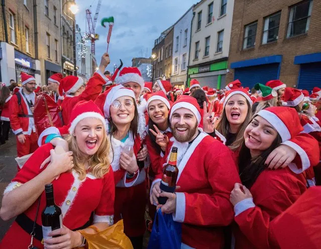 Santa Claus flash mob partying on the street in Waterloo, London, UK on 8th December 2018. (Photo by RedDotRed/Rex Features/Shutterstock)