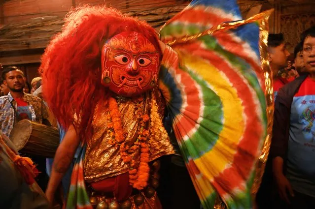 A mask dancer locally known as “Lakhey” performs on the last day of the “Indra Jatra” festival in Kathmandu, on October 2, 2023. (Photo by Prakash Mathema/AFP Photo)