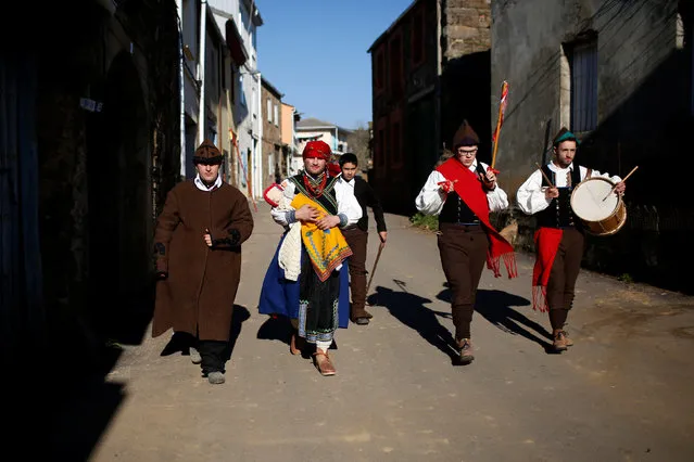 People in costumes take part in the “Los Carochos” winter masquerade in Riofrio de Aliste, Spain, January 1, 2017. (Photo by Juan Medina/Reuters)