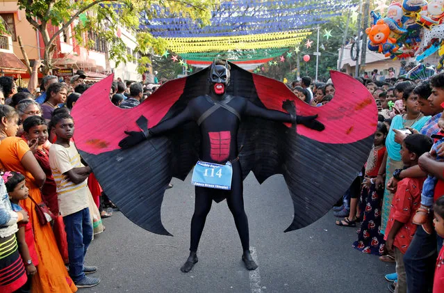 A reveller dressed as Batman performs in the 35th Cochin Carnival, which is held annually to welcome the start of the New Year at Fort Kochi in Kerala, India, January 1, 2019. (Photo by Sivaram V/Reuters)