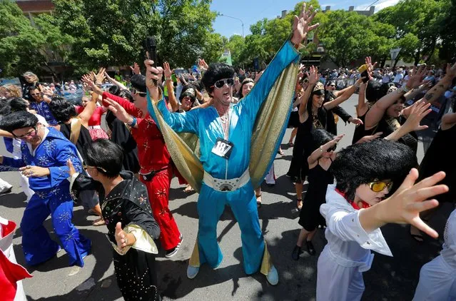 Children and adults dressed as Elvis Presley participate in a street parade at the 25th annual Parkes Elvis Festival in the rural Australian town of Parkes, west of Sydney, January 14, 2017. (Photo by Jason Reed/Reuters)