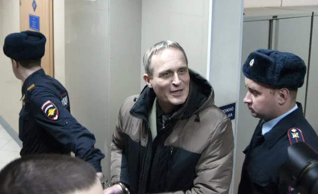 In this handout photo released by Courtesy of Jehovah's Witnesses, Dennis Christensen, who was leading the local Bible reading, is escorted from a court room in Oryol, Russia, Wednesday, February 6, 2019. A regional court in western Russia on Wednesday sentenced a Danish Jehovah’s Witness to six years in prison, in arguably the most severe crackdown on religious freedom in Russia in recent years. (Photo by Yuriy Temirbulatov/Courtesy of Jehovah's Witnesses via AP Photo)