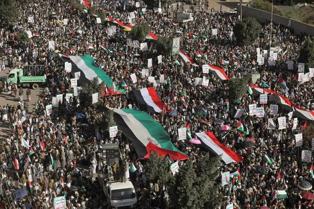 People rally to protest against the Israeli air strikes on the Gaza Strip, in Sanaa, Yemen on October 13, 2023. (Photo by Khaled Abdullah/Reuters)