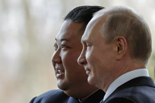 Russian President Vladimir Putin, right, and North Korea's leader Kim Jong Un pose for photographers during their meeting in Vladivostok, Russia, Thursday, April 25, 2019. Putin and Kim are set to have one-on-one meeting at the Far Eastern State University on the Russky Island across a bridge from Vladivostok. The meeting will be followed by broader talks involving officials from both sides. (Photo by Alexander Zemlianichenko/AP Photo/Pool)