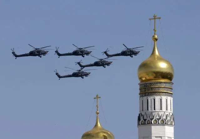 Mi-28 military helicopters fly in formation during the Victory Day parade above Red Square in Moscow, Russia, May 9, 2015. (Photo by Tatyana Makeyeva/Reuters)