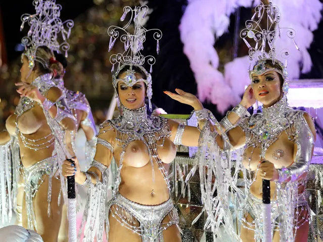 Revelers of the Grande Rio samba school perform during the first night of carnival parade at the Sambadrome in Rio de Janeiro, Brazil on March 2, 2014. (Photo by Tasso Marcelo/AFP Photo)